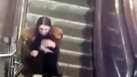 An escalator eats a girl’s jacket