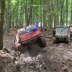 Guy Drives SUV Into Deep Muddy Puddle and Gets Stuck